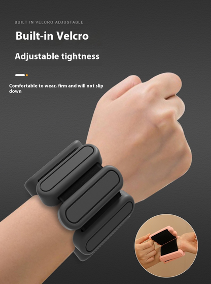 Black adjustable wristband on a wrist with text highlighting features