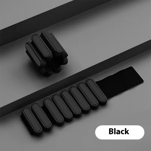 Black weight strap on a gray surface with 'Black' label