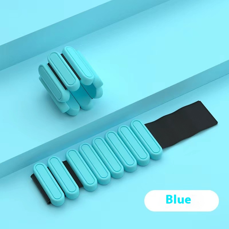 Blue weighted bracelet on a gray surface with 'Blue' label