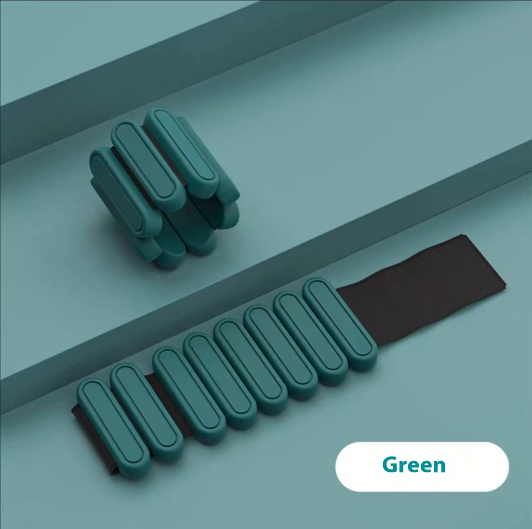 Green weight bracelet on a gray surface with 'Green' label