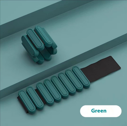 Green weight bracelet on a gray surface with 'Green' label