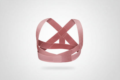 Pink corset-style garment on a white background